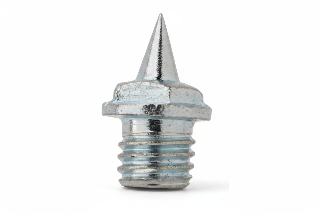 A single silver metal needle spike used for track shoes.